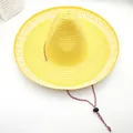 Close-up of yellow Mexican straw hat with wide patterned brim and adjustable strap - L (58-60cm) / Yellow