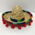 Close-up of a mini Mexican straw hat with a colorful woven band and red pom-poms decoration - Size 3 / Headband Style