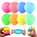 Detailed macro view of colorful squishy stress relief balls being squeezed and stretched. - Multicolor / 3.5cm Size