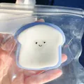 Cute toast-shaped squishy toy for stress relief with blue edges and smiley face - Blue Westie Toast Slice