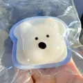Blue Westie dog toast squishy stress relief toy inside a transparent plastic bag - Blue Westie Dog Toast