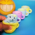 Creative cute squirrel in cup squeeze toy in yellow finish for stress relief and fun - Teacup Squirrel Cup
