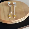 Detalle de pendientes de clip de estrella con circonitas y borlas colgantes elegantes - Pendientes de clip / Plata-Amarillo