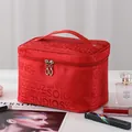 Elegant large capacity red portable makeup bag with top handle and dual zipper closure - Red Letter