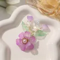 Handgemaakte haaraccessoire met paarse kristallen bloemen en goudkleurig draad. - Paarse Parelblaam / 1 Stuk / Paars
