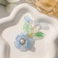 Elegante handgemaakte blauwe kristallen bloem haaraccessoire met gouden bladeren - Blauwe kunstparelbloem / 1 Stuk / Blauw