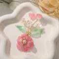 Handgemaakte roze kristallen bloem accessoire met groene bladeren voor creatieve DIY haarjuwelen - Roze Parelbloem / 1 Stuk / Roze