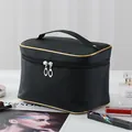 Elegant large capacity black travel makeup bag with gold trim and convenient handle - Solid Black