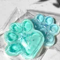 Dettaglio macro di squishy a zampa di gatto gigante trasparente con glitter e perle. - [275 G] Zampa Di Gatto Gigante Di Sale Marino [15*14] [colore Casuale]