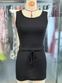 Close-up of black sleeveless knitted tank dress with ribbed texture and drawstring waist. - S / Dresses / Black