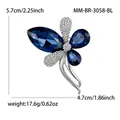Especificaciones detalladas de tamaño y peso para el elegante broche de cristal azul. - Azul
