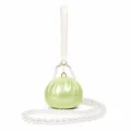Detail of lime green acrylic shell evening bag with elegant pearl handle and crossbody strap - Bun Shape Green