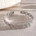 Macro view of silver wavy braided choker showing intricate cross-texture details - Silver