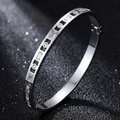 Silver-toned stainless steel bangle decorated with rectangular and round cubic zirconia - Full Zirconia Style / Inner Diameter 51x60mm / Steel Color (42-B-7)