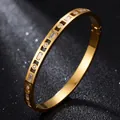 Luxury gold-plated stainless steel bangle with baguette and round cubic zirconia stones. - Full Zirconia Style / Inner Diameter 51x60mm / Gold (42-B-8)