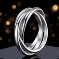 Elegante anillo giratorio minimalista de acero inoxidable con tres bandas cruzadas - US 5 / Color acero