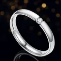 Elegant minimalist silver-tone titanium steel band ring featuring a single round-cut stone - Size 6 / Steel