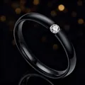 Elegant black titanium steel ring featuring a single sparkling center stone - Size 7 / Black