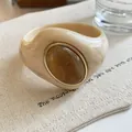 Detailed macro view of a chunky marbled acrylic bracelet with a gold-rimmed resin inlay. - Geometric Open Style (5#)