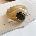 Detail view of chunky marbled acrylic bangle with a dark green resin centerpiece - Geometric Open Style (12#)