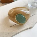 Close-up detail of oversized marbled acrylic bangle featuring green oval stone - Geometric Open Style (14#)