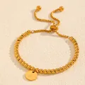 High-quality close-up of gold-plated steel bead bracelet featuring an initial A pendant - Letter A Style (238224) / Gold