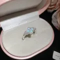 Close-up of a vintage zircon ring with a blue clover motif in a pink jewelry box - Four Leaf Clover Style (6#) / Silver Blue
