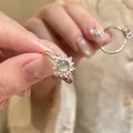 Close-up of a vintage palace style zircon ring with a green gem held by hand - Silver Light Green Flower (4#) / Silver/Green