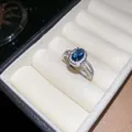 Detail view of vintage silver ring with oval blue gemstone and sparkling zircon halo - Deep Blue Oval Main Stone (22#) / Blue Oval