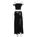 Detalle de conjunto negro de dos piezas con flores metálicas y falda con abertura. - S / Negro