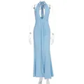 Elegant light blue halter maxi dress with a deep V-neck and backless design for resort wear. - Blue