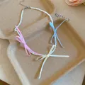 Close-up of dopamine beaded necklace with colorful ribbon bows on paper box background - Iridescent Pink Yellow Blue Bowknot Style (HN12753) / Pink-Yellow-Blue