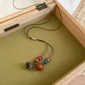 Collana retrò stile etnico con ciondolo in legno a ghianda su cordino di cuoio - Stile Ciondolo Ghianda in Legno (HN12992-1) / Marrone