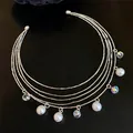 Elegant detail of a multi-layer silver choker necklace with dangling pearls and iridescent crystals - Choker Necklace / Silver