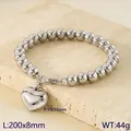 Elegant silver stainless steel beaded bracelet featuring a large polished heart charm - Steel