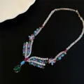 Detailed view of luxury necklace with multi-colored teardrop zircon stones - Necklace / Silver - Rainbow