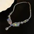 Sparkling cubic zirconia teardrop pendant necklace close-up showing radiant stone fire - Necklace / Silver-White