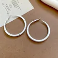 Close-up detail showing the matte silver finish and polka dot pattern of these hoop earrings - Black Polka Dot Hoop Style (70#) / 5cm / Brushed Silver