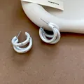 Detailed view of matte silver double hoop earrings with black polka dot design - Double Layer Overlapping Polka Dot C-Shape Style (71#) / Matte Silver