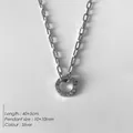 Collier trombone en acier inoxydable argenté avec pendentif cercle strass - Chaîne Trombone Fermoir Coeur Argent (XNL0012-1)