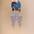 Close-up of 18k gold-plated zircon tassel earrings with purple grape-like beads - Silver-Purple