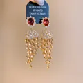 Close-up of luxury 18k gold plated zircon tassel earrings with red gemstone - Gold Brown