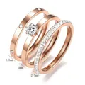 Detailed view of three-piece rose gold stainless steel ring set with zircon accents. - Size 5 / 3-Piece Set Style / Rose Gold
