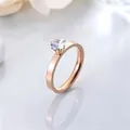Close-up of elegant rose gold stainless steel solitaire ring with sparkling zircon stone. - Size 5 / Rose Gold