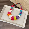 Detailed view of vibrant round beads on a colorful dopamine necklace with marble texture - Colorful