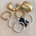 Detail shot of French-style pearl and gold-tone beaded bracelet and bangle set - 7-piece Set / 67# Bangle Gold White Pearl