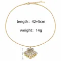 Elegant two-tone gold and silver fan pendant necklace on a sleek snake chain - Two-Tone Shell Pendant Style
