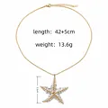Elegant bicolour gold and silver textured starfish pendant necklace with adjustable chain. - Two-Tone Sea Star Pendant Style