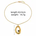 Elegant gold stainless steel snake chain necklace with irregular oval evil eye pendant - Irregular Fluid Eye Pendant Style