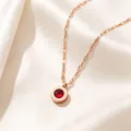 Macro view of rose gold Roman numeral necklace with a red crystal pendant - Rose Gold Red